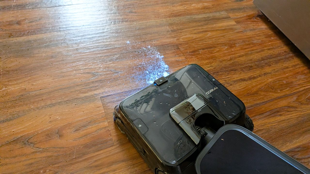 Tineco Floor ONE Station S9 Scientist Pro wet and dry vacuum cleaner vacuuming up flour