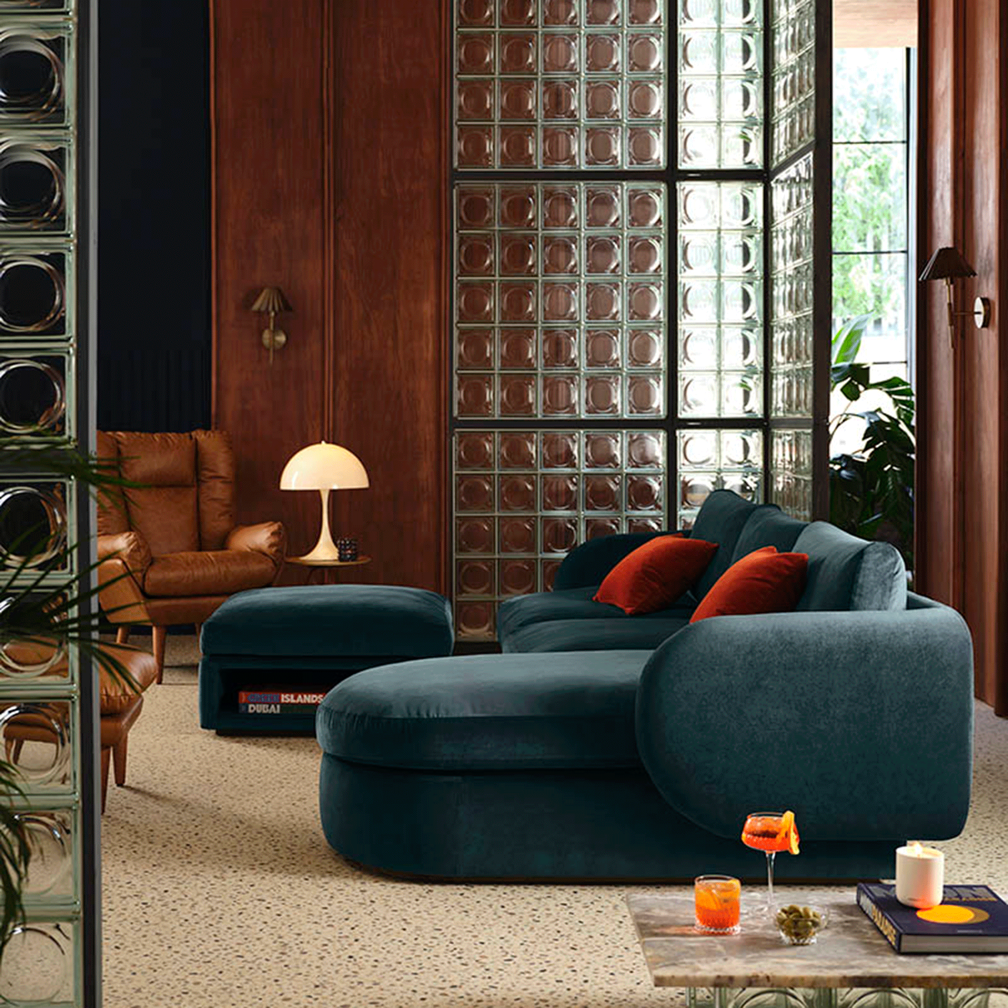 Navy sofa in mid-century styled living room