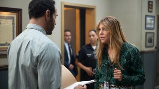 Kaitlin Olson and Daniel Sunjata talking intensely on High Potential.