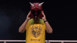Old School RuneScape dev Mod Kieren in yellow shirt on RuneFest stage