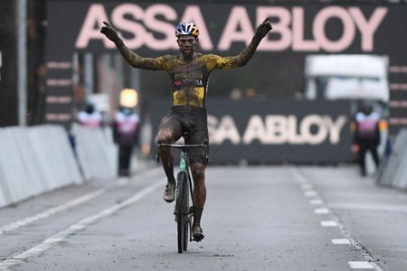Belgian Wout Van Aert celebrates as he wins the men elite race of the World Cup cyclocross in Dendermonde third stage out of five of the UCI World Cup competition in Dendermonde Sunday 27 December 2020BELGA PHOTO DAVID STOCKMAN Photo by DAVID STOCKMANBELGA MAGAFP via Getty Images
