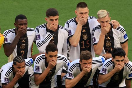 The German national soccer team protests during the 2022 World Cup. 