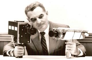 Stan Lebar in 1969 with the Westinghouse color and monochrome cameras used in the manned lunar mission.