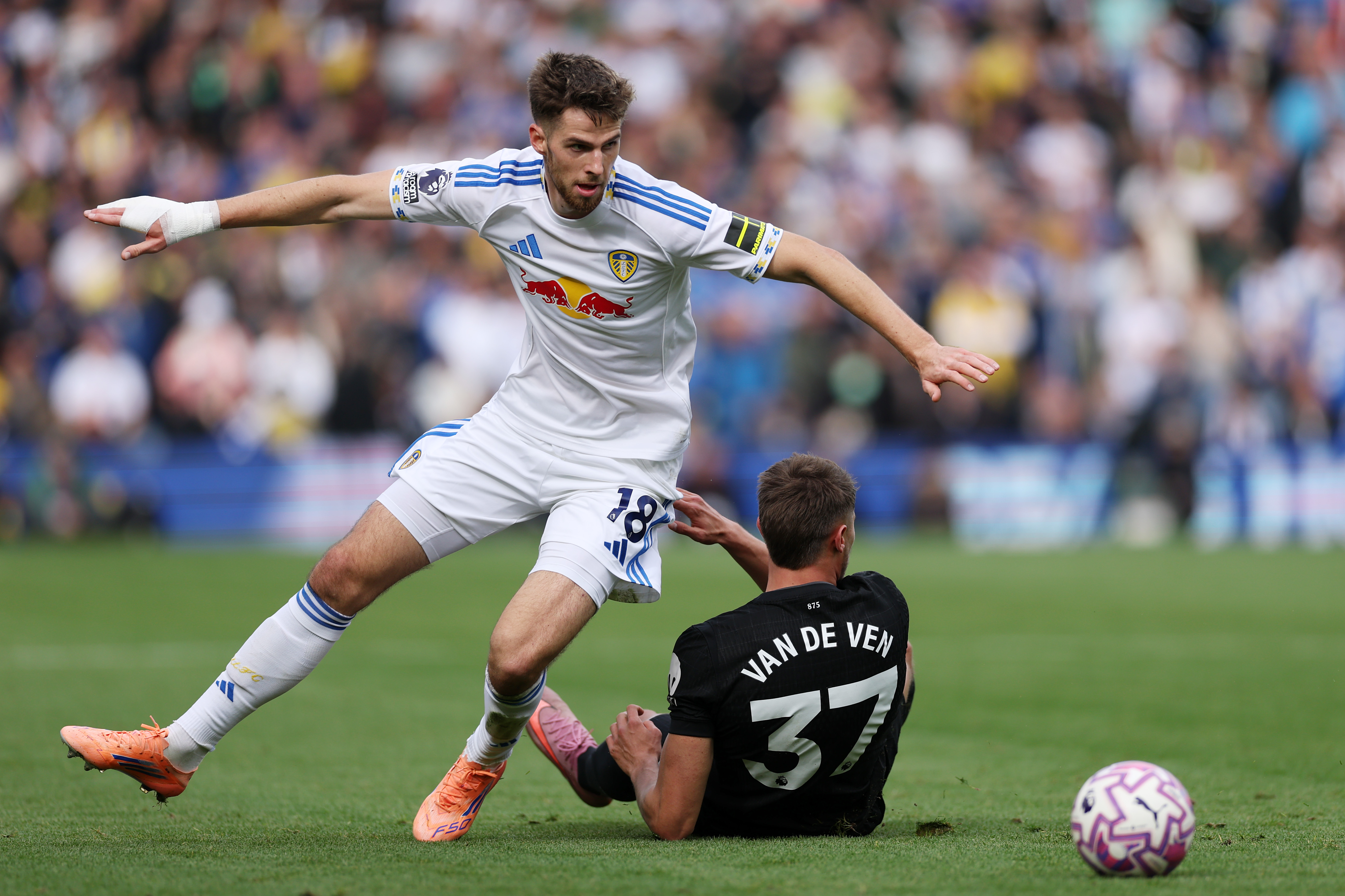 LEEDS, ENGLAND - OCTOBER 04: Anton Stach of Leeds United and Micky van de Ven of Tottenham Hotspur compete for the ball during the Premier League match between Leeds United and Tottenham Hotspur at Elland Road on October 04, 2025 in Leeds, England. (Photo by Stu Forster/Getty Images)
