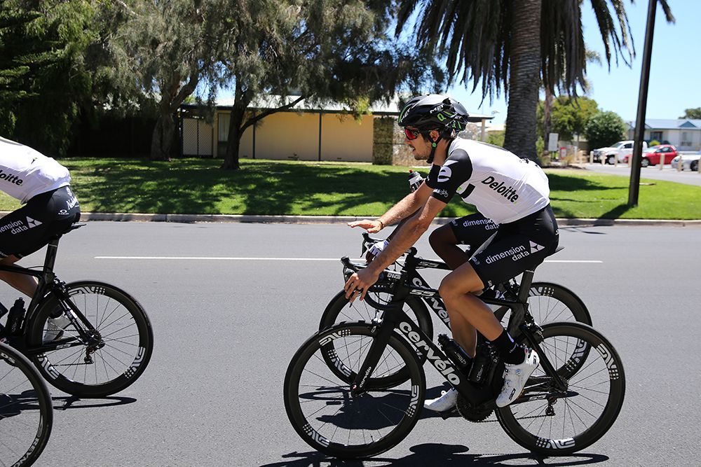 A white jersey but black shorts and black socks