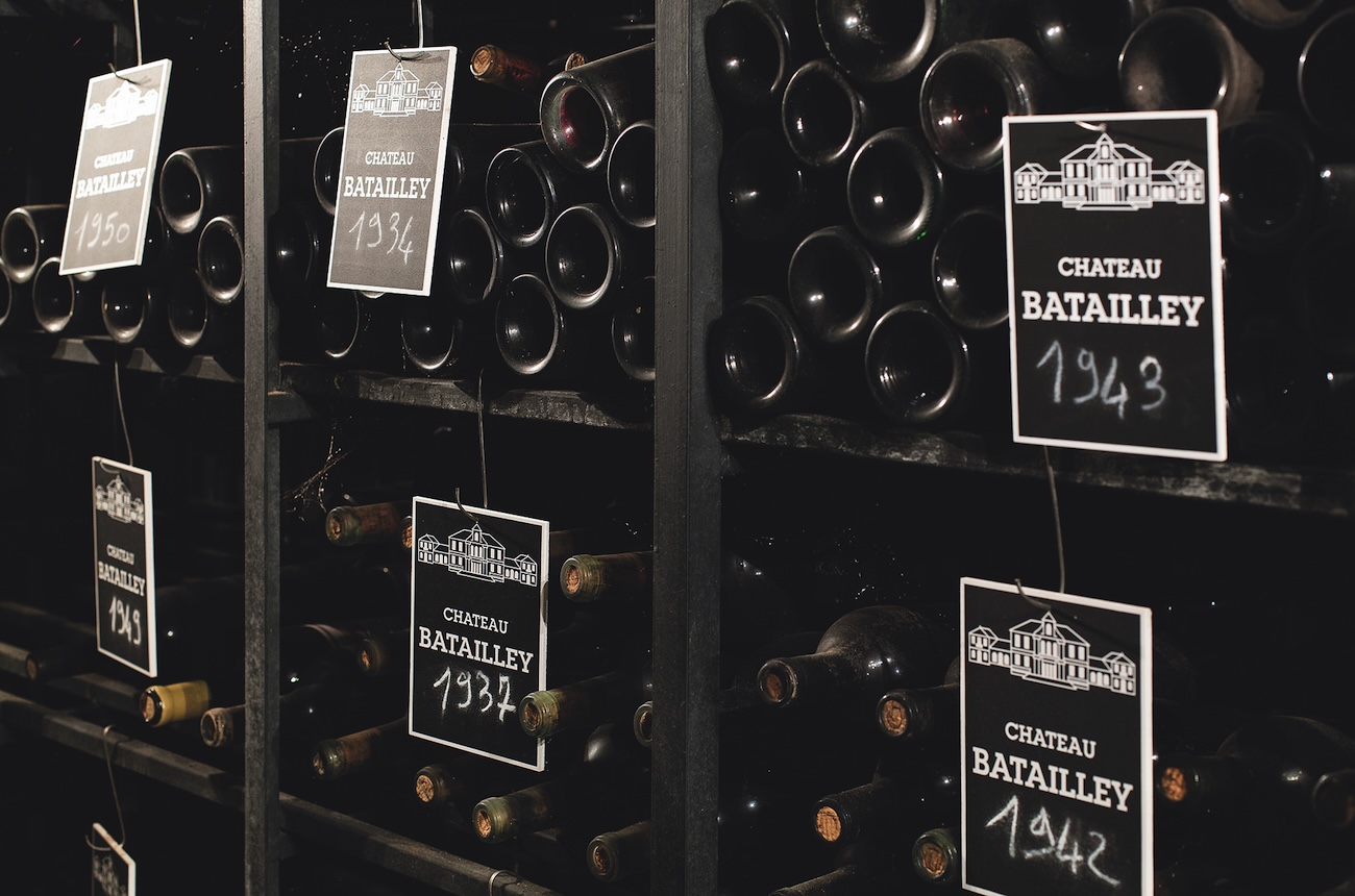 old bottles in the cellar at Ch&amp;acirc;teau Batailley