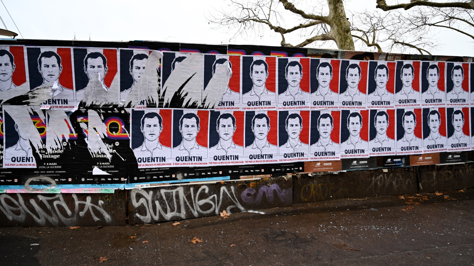 Many identity and royalist far right wing posters with written on them QUENTIN KILLED BY MELENCHON S MILITIA are pasted on a wall in the street following the death of far right radical identitarian and nationalist activist Quentin DERANQUE in Lyon in France on February 19 2026. (Photo by Matthieu Delaty / Hans Lucas / AFP via Getty Images)