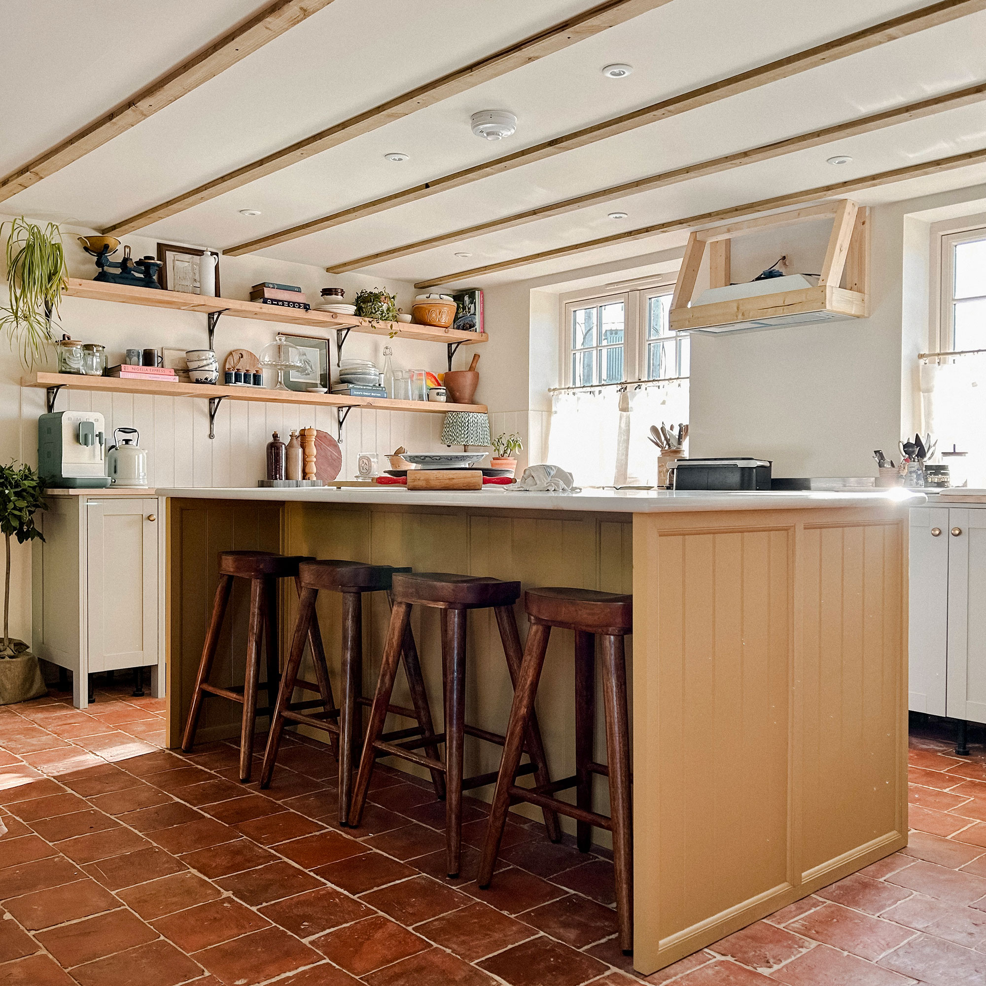 Kitchen with island and bar stools