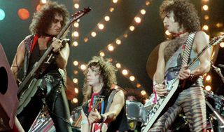 (from left) Gene Simmons, Vinnie Vincent and Paul Stanley perform with Kiss at Wembley Arena in London on October 23, 1983