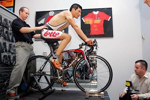Fred Rodriguez gets his bike fit evaluated by Nate Koch, Edurance Rehab (L) and Pairic McGlynn, eSoles (R.
