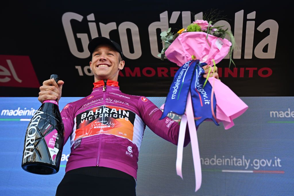 MONTE LUSSARI ITALY MAY 27 Jonathan Milan of Italy and Team Bahrain Victorious Purple Points Jersey celebrates at podium during the 106th Giro dItalia 2023 Stage 20 a 186km individual climbing time trial stage from Tarvisio 750m to Monte Lussari 1744m UCIWT on May 27 2023 in Monte Lussari Italy Photo by Stuart FranklinGetty Images