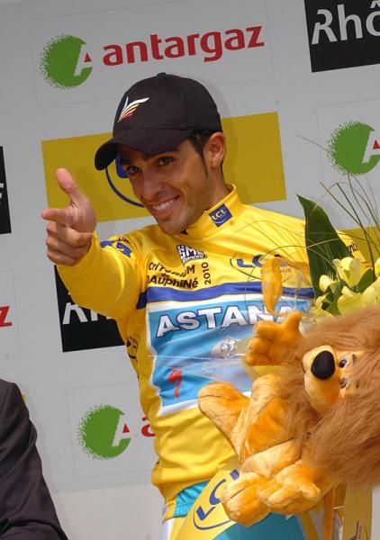 Alberto Contador (Astana) gives his trademark salute from the podium.