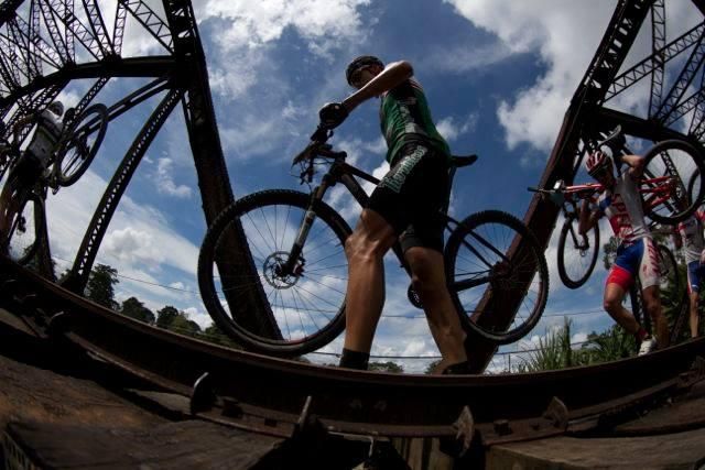 Paolo Montoya on a railroad bridge