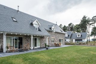 Thick natural slate roof tiles on a house in Scotland