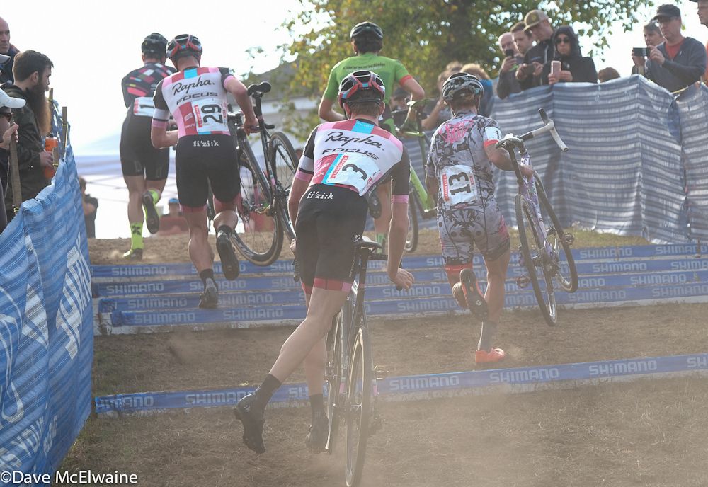 The leaders running the stairs in the dust after early rain had knocked it down a bit.
