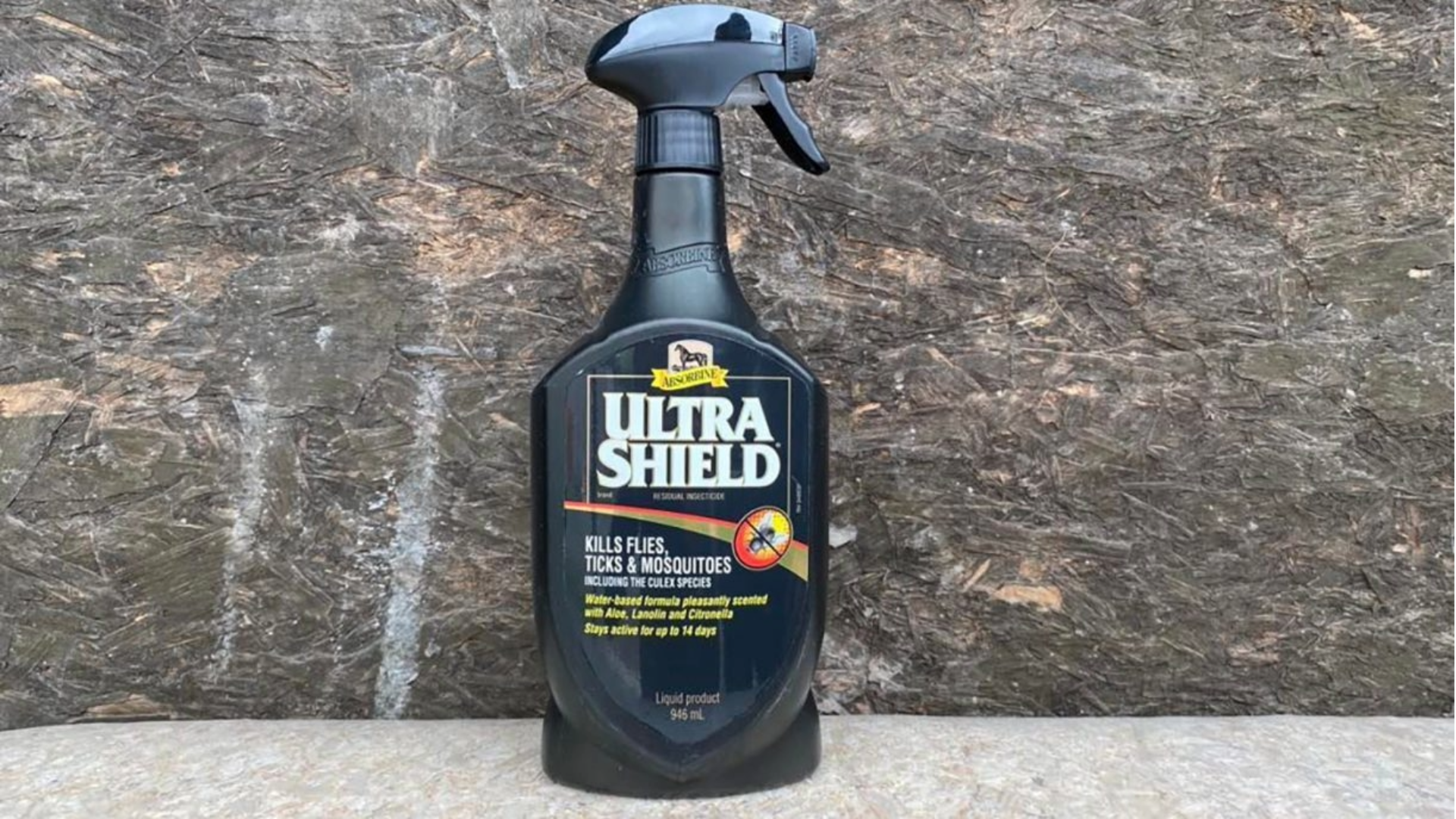 Absorbine UltraShield Insecticide, one of the best fly sprays for horses, on a stone background