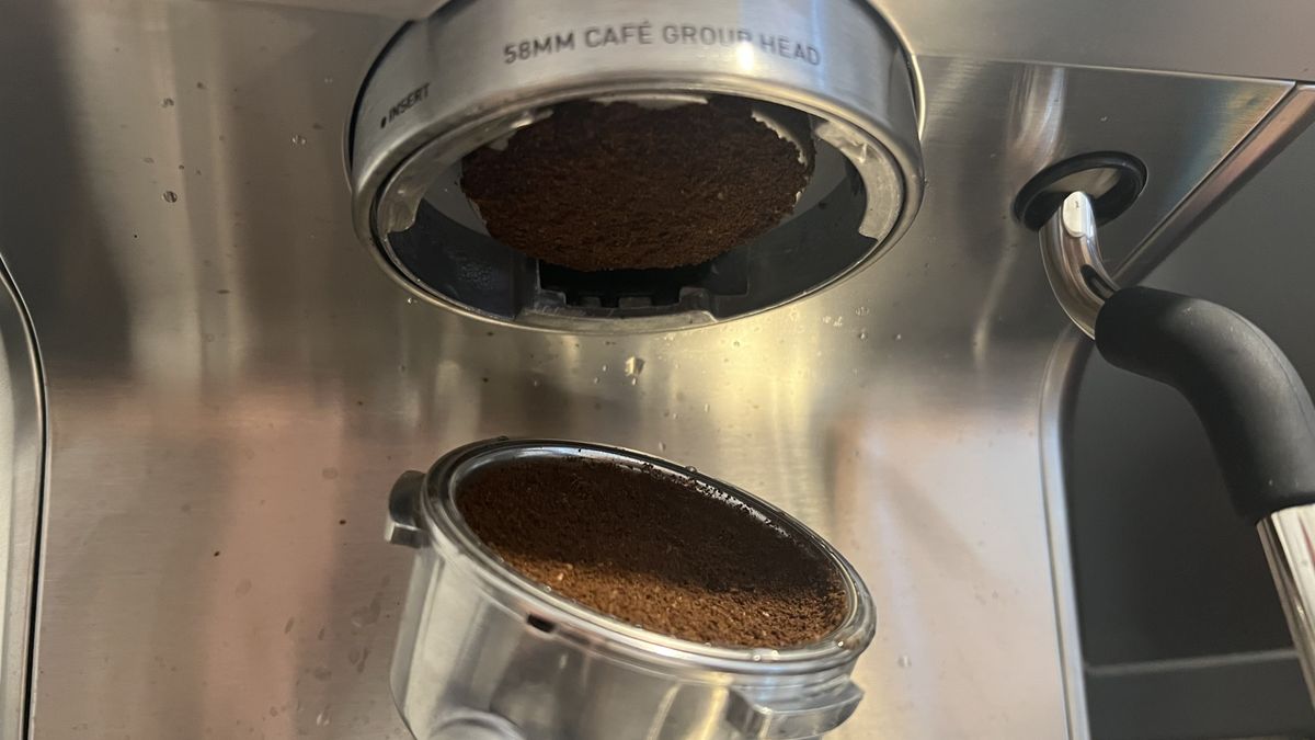 REmoving portafilter from Casabrews Ultra Espresso Machine with coffee stuck on screen