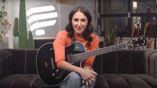 Dr Molly Miller plays a Taylor electric guitar