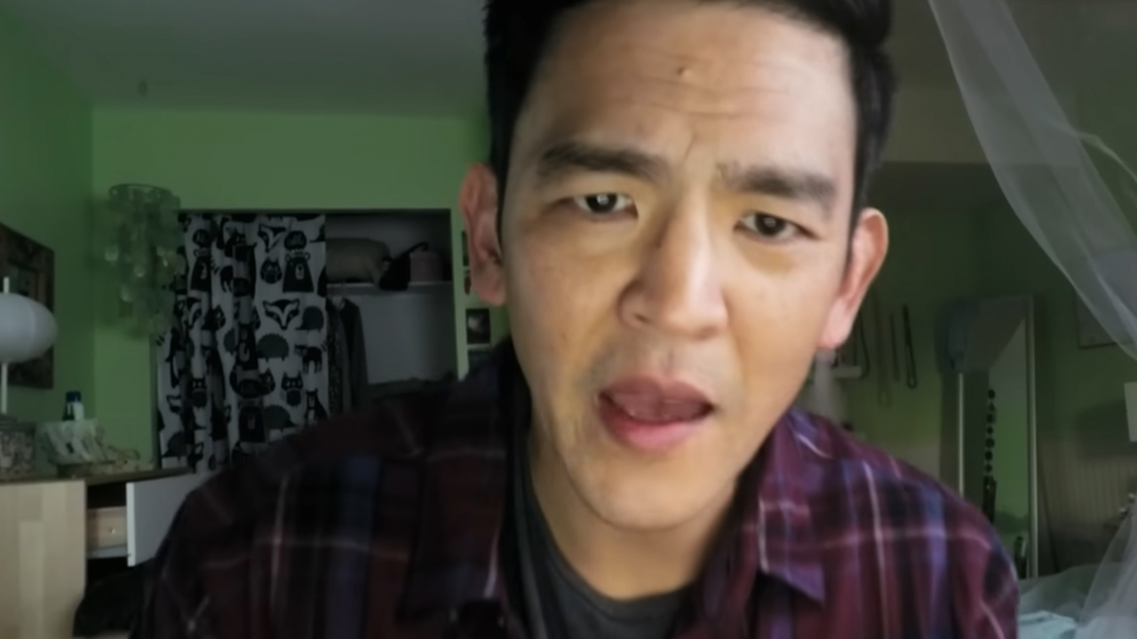 A close up of John Cho looking shocked in Searching