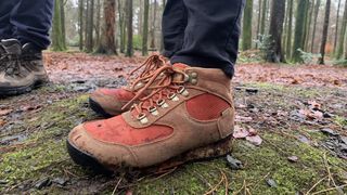 A hiker's feet wearing the Danner Jag II boots on the trail