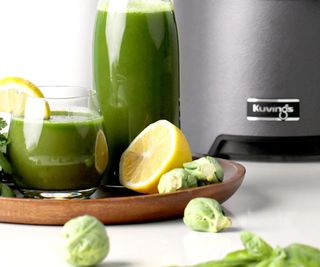 Green juice in a Kuvings juicer.