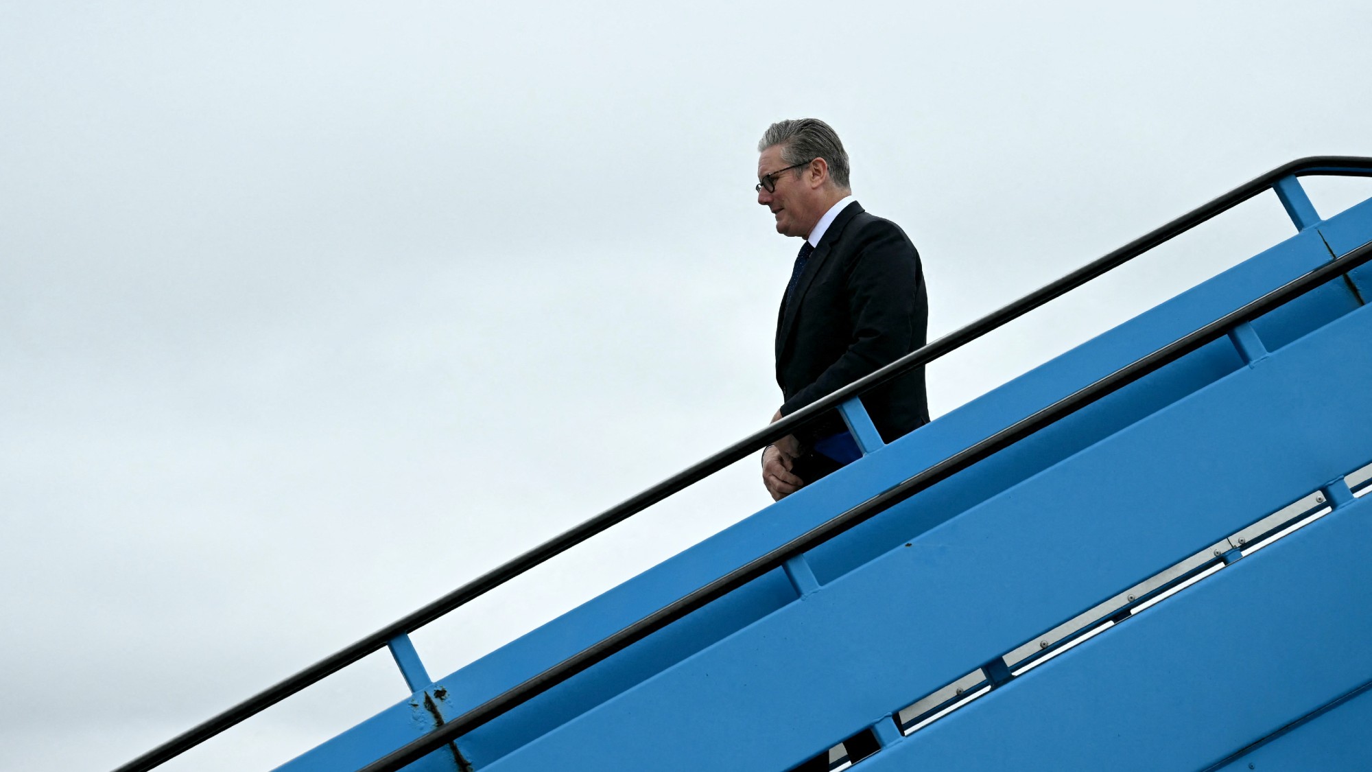 Keir Starmer leaving his plane as he arrives for a two-day Nato summit in The Hague