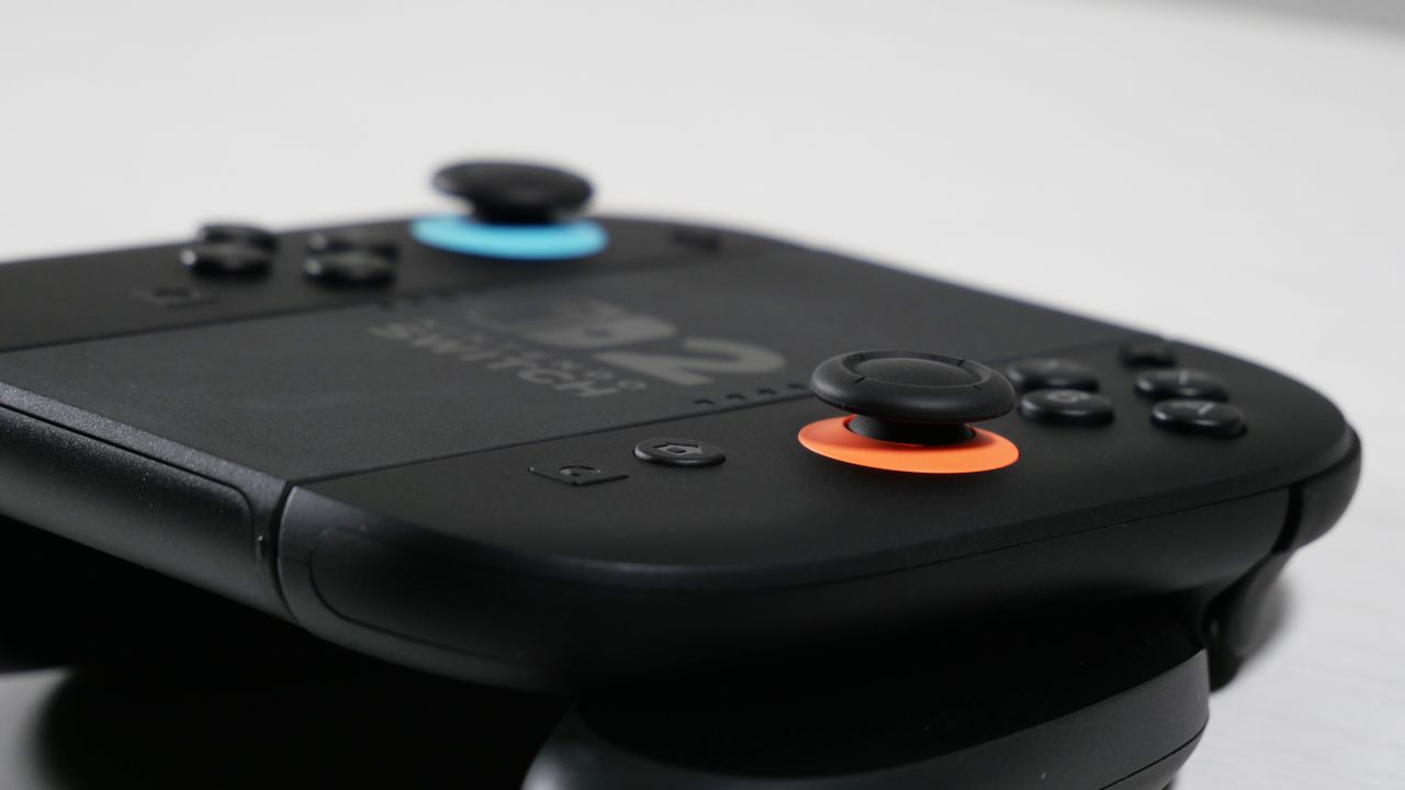 Nintendo Switch 2 Joy-Con 2 Grip, highlighting the Red Analog Stick.