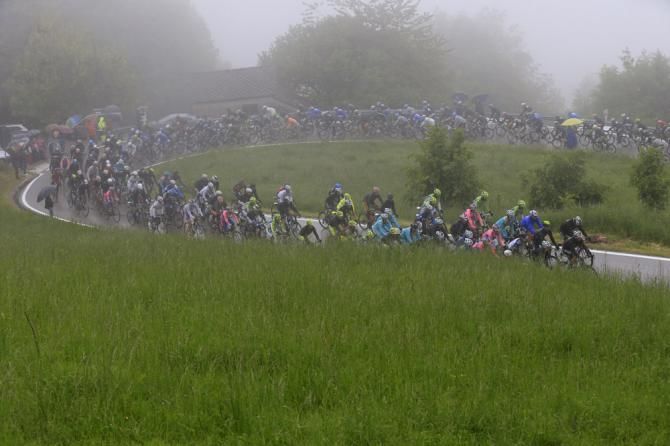 The peloton winds its way up a climb on a wet and miserable 12th stage of the Giro.