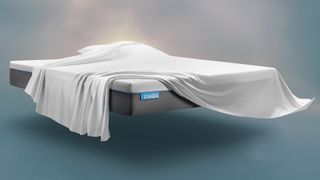 The Simba Hybrid Essential Mattress against a rendered background with a sheey and pillow lying on top of the mattress