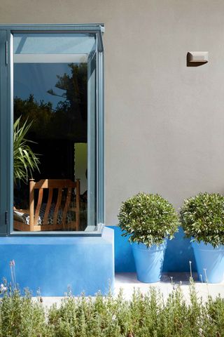 little greene painted blue plant pots and exterior features of house