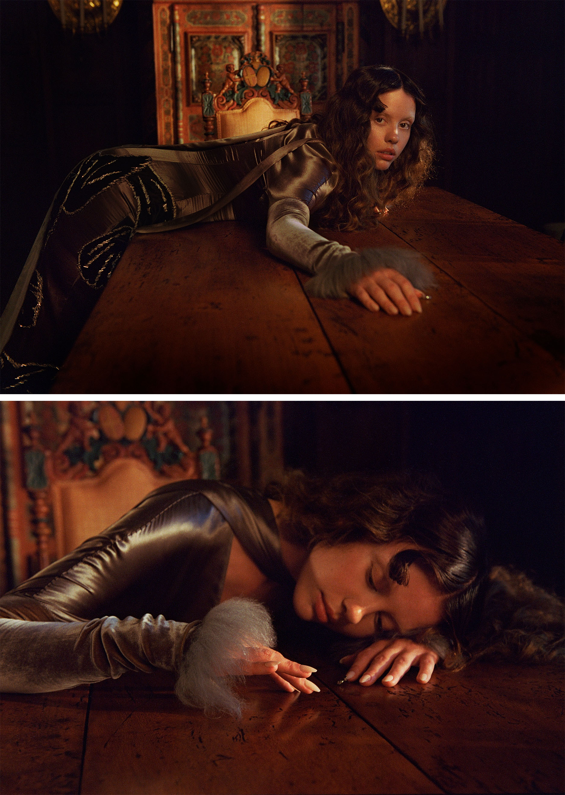 Mia Goth photo shoot for Who What Wear&#039;s October Cover Story. In these images, Mia is seen at a wood table. In the top image, she is leaning over the table looking to camera wearing a gray satin and velvet dress. In the bottom image, she is seen with her head down on the table tracing something with her fingers.