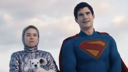 Superman standing with Kara and Krypto in snow looking at Fortress of Solitude in Supergirl