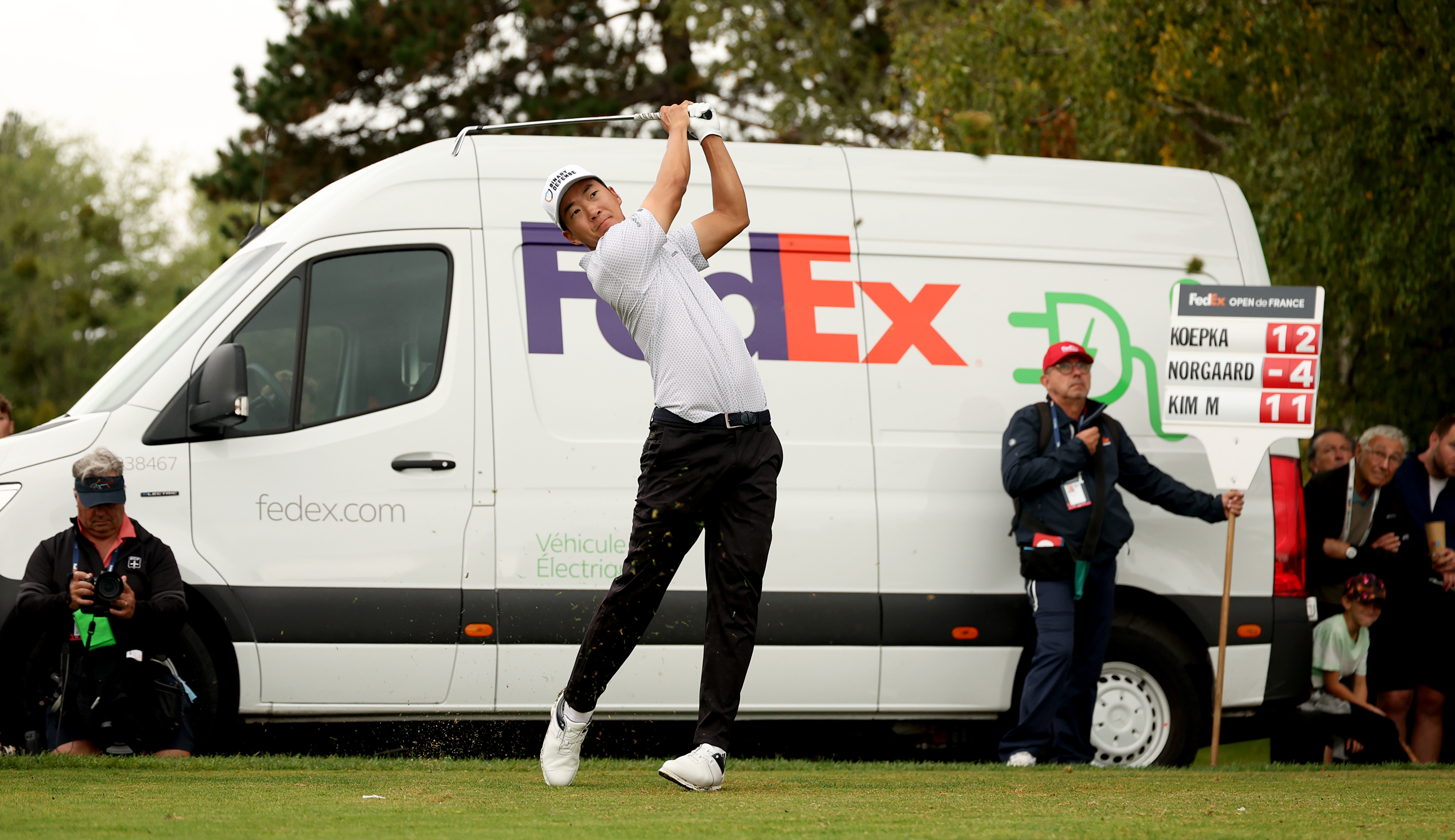 Michael Kim hits an iron shot