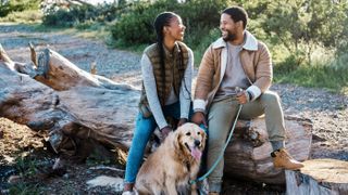 couple hiking with dog