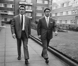 Ronnie and Reggie Kray outside Cedra Court