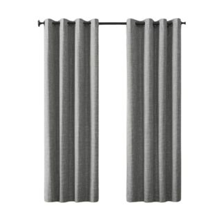Two gray curtain panels on a black rod