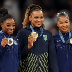 Rebeca Andrade of Team Brazil, and Simone Biles and Jordan Chiles of Team United States make history with the first all-Black podium in the Artistic Gymnastics Women's Floor Exercise Medal Ceremony at the Paris Olympics 2024.