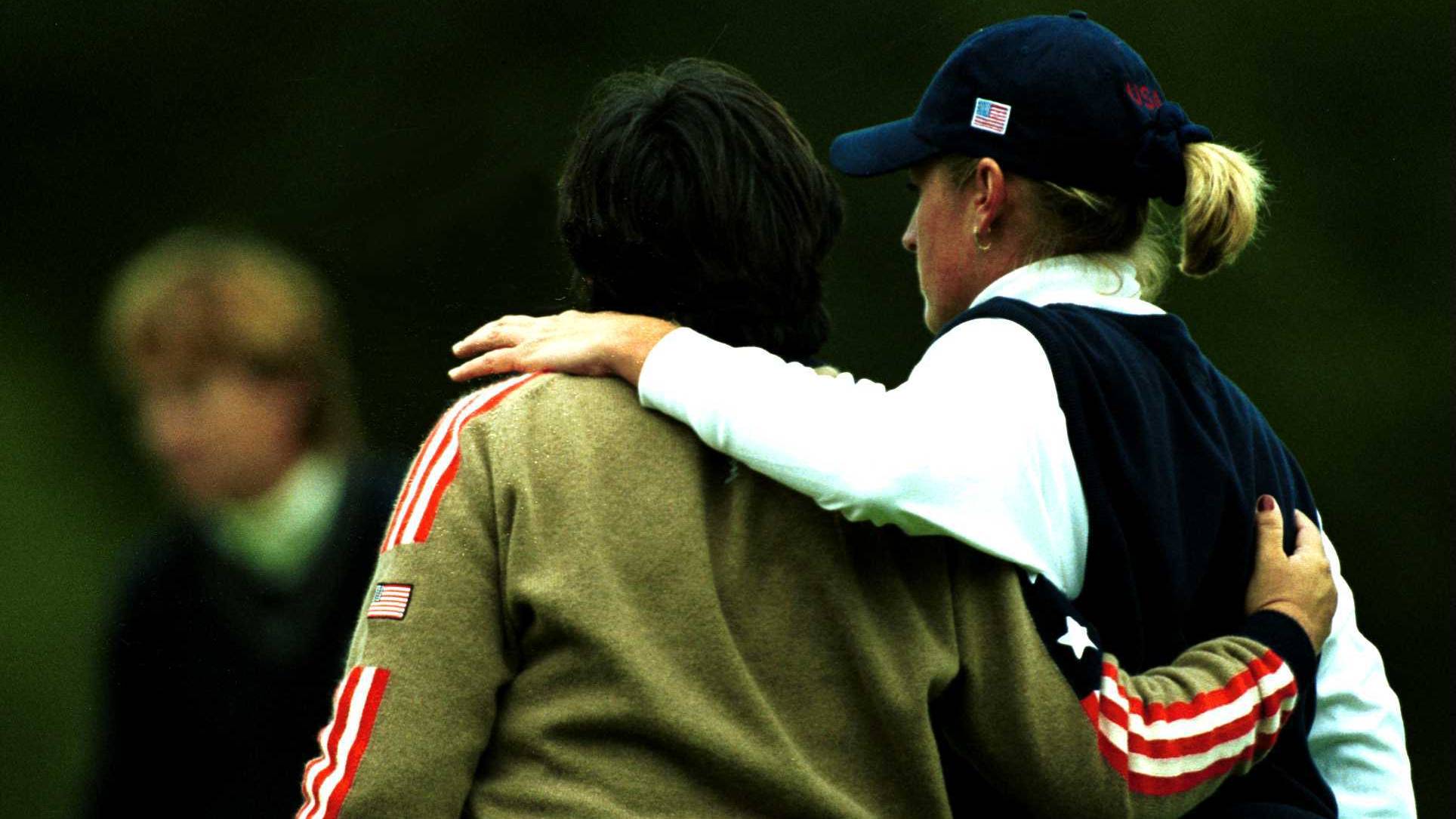 Pat Hurst and Kelly Robbins hug during the 2000 Solheim Cup