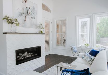 white living room with modern fireplace