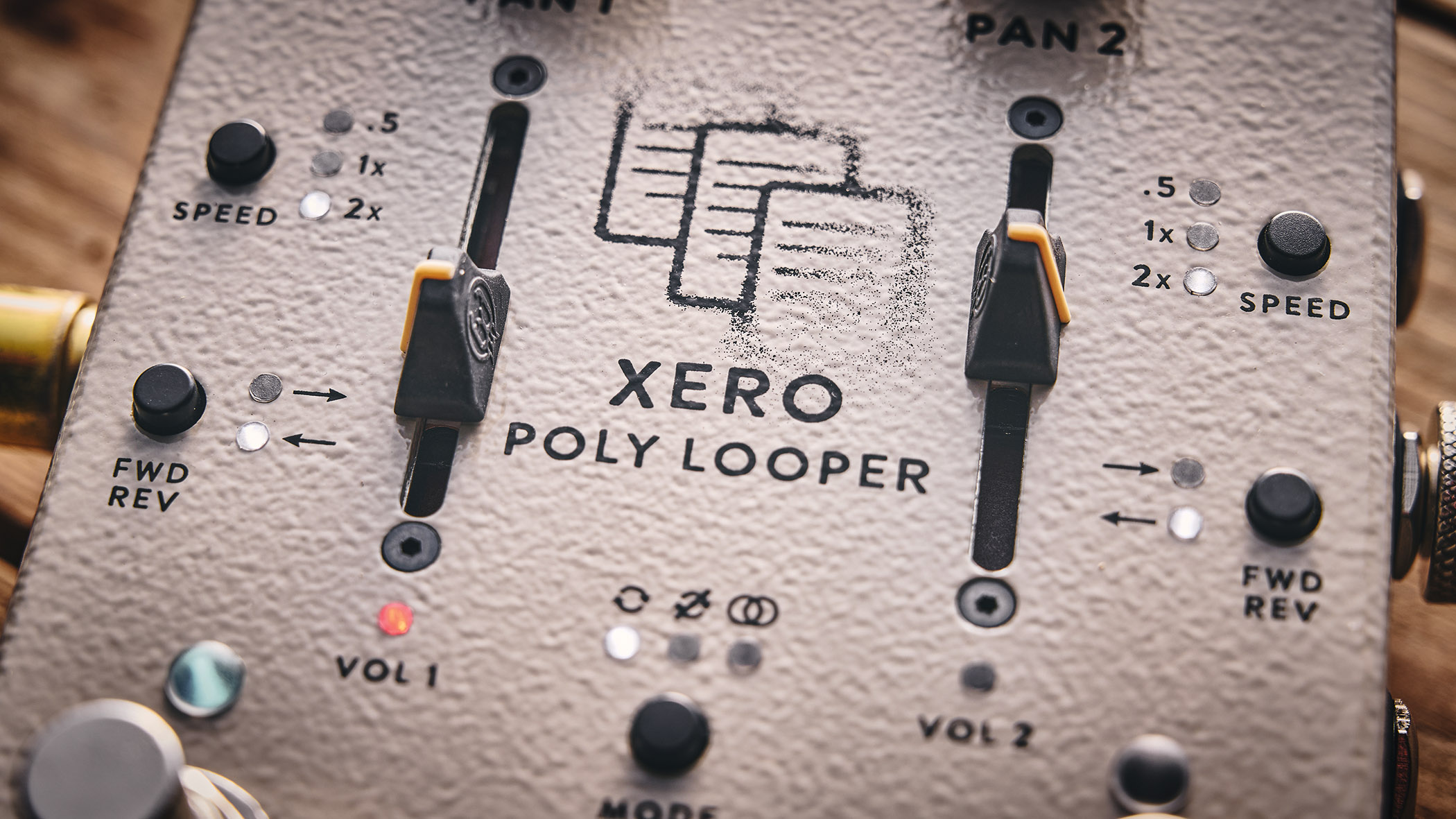 Walrus Audio Xero Polylooper: the dual-slider and footswitch looper is photogaphed against a wooden floor.