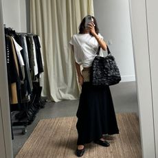 Camelia Farhoodi taking a mirror selfie.