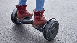 Person's feet on hoverboard