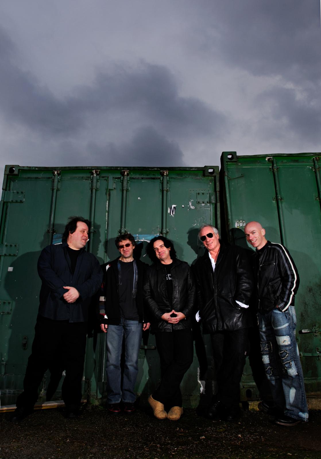 Marillion standing in front of a shipping container