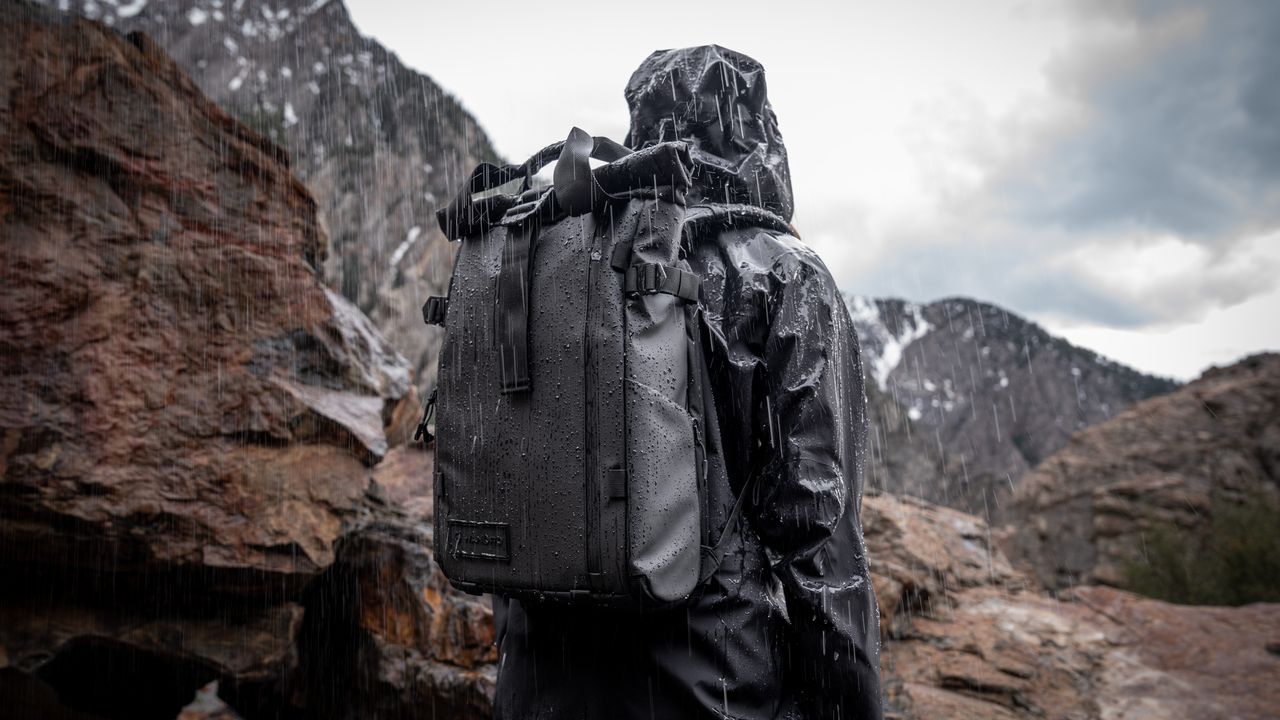 The Wandrd Prvke camera backpack being worn in the rain