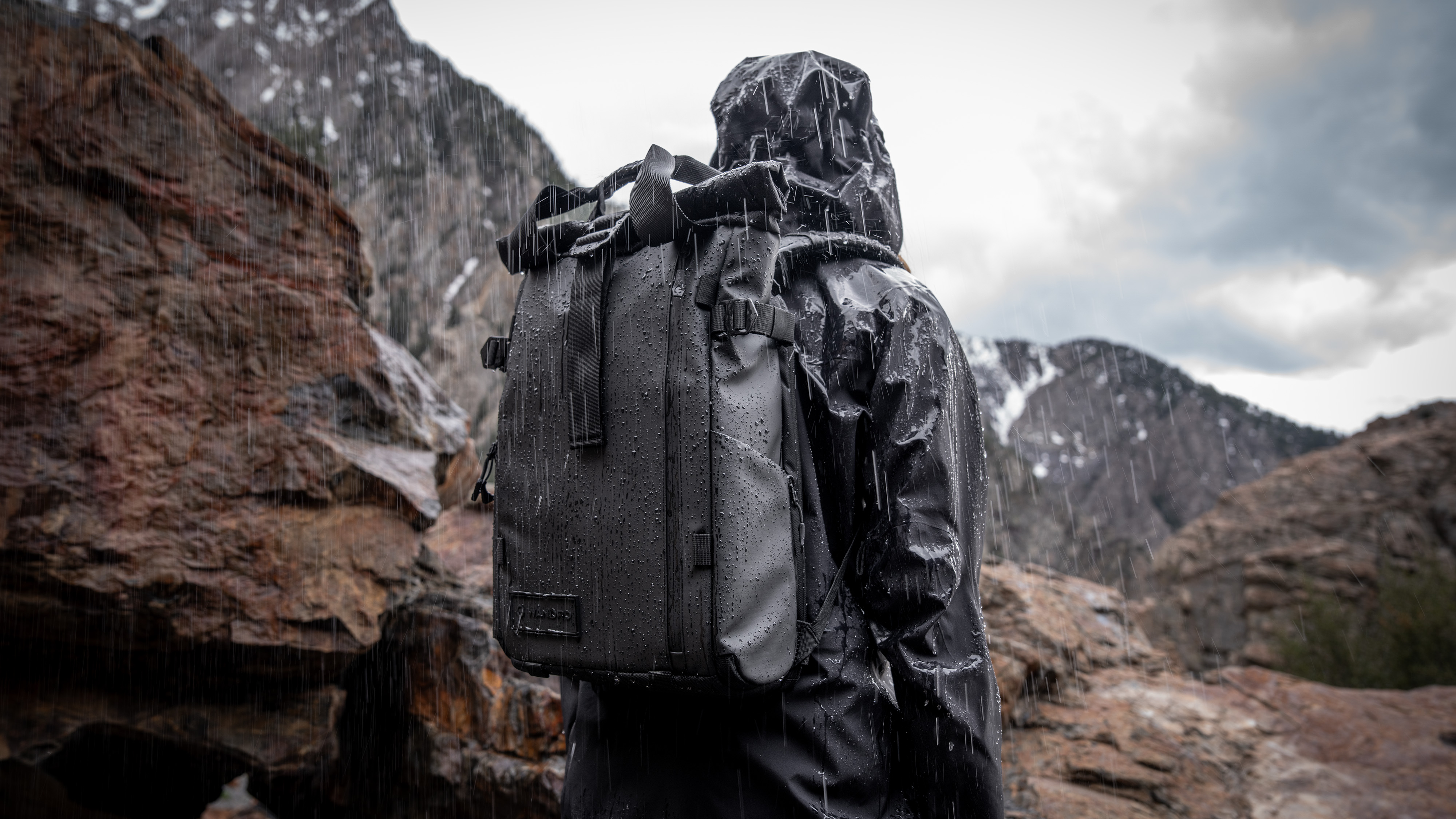 The Wandrd Prvke camera backpack being worn in the rain