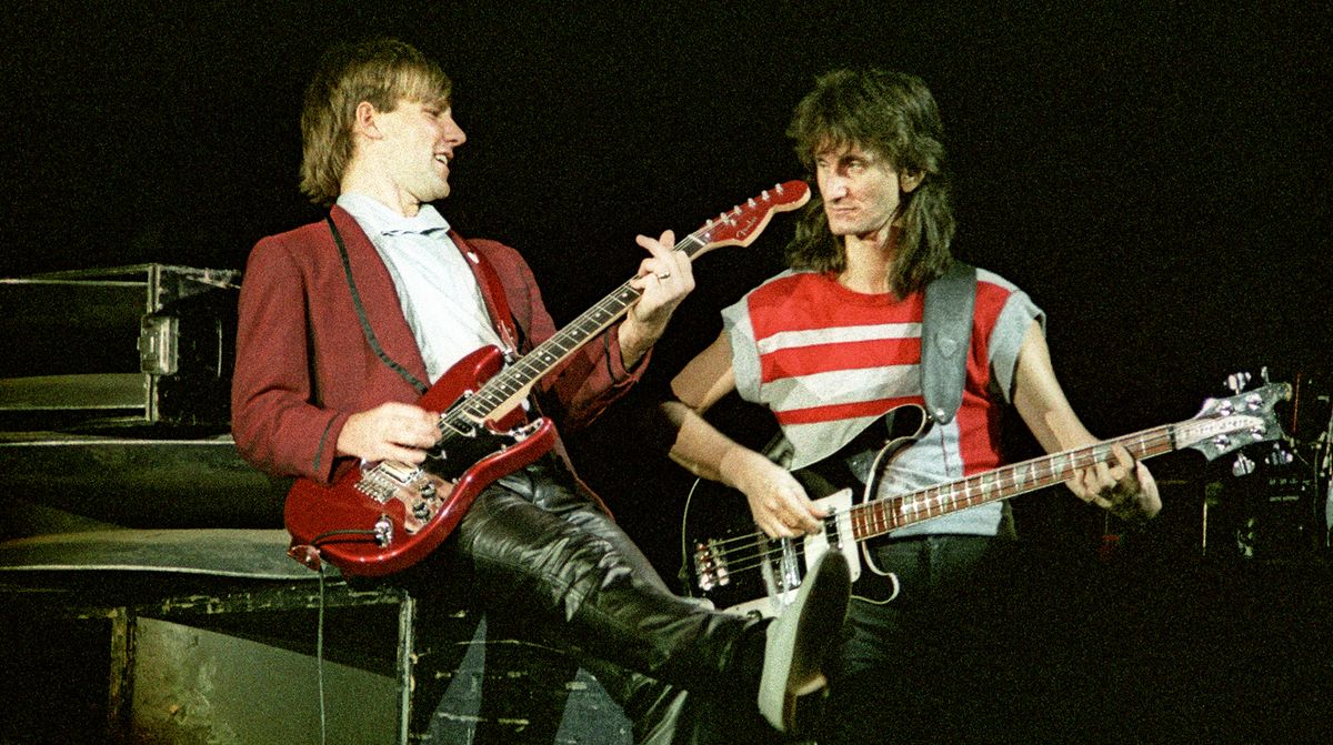 Alex Lifeson and Geddy Lee of Canadian band Rush perform on stage on the &#039;Signals&#039; tour at Wembley Arena on May 20th, 1983 in London, England. Lifeson is playing his red Hentor Sportscaster