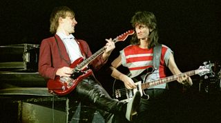 Alex Lifeson and Geddy Lee of Canadian band Rush perform on stage on the 'Signals' tour at Wembley Arena on May 20th, 1983 in London, England. Lifeson is playing his red Hentor Sportscaster