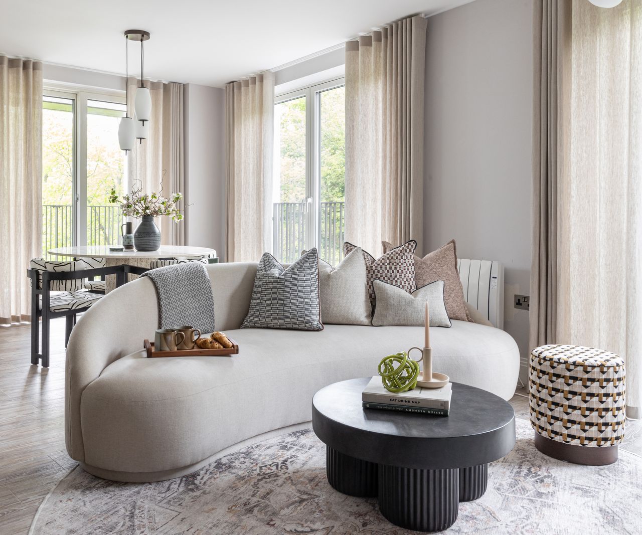 living room with cream curved sofa