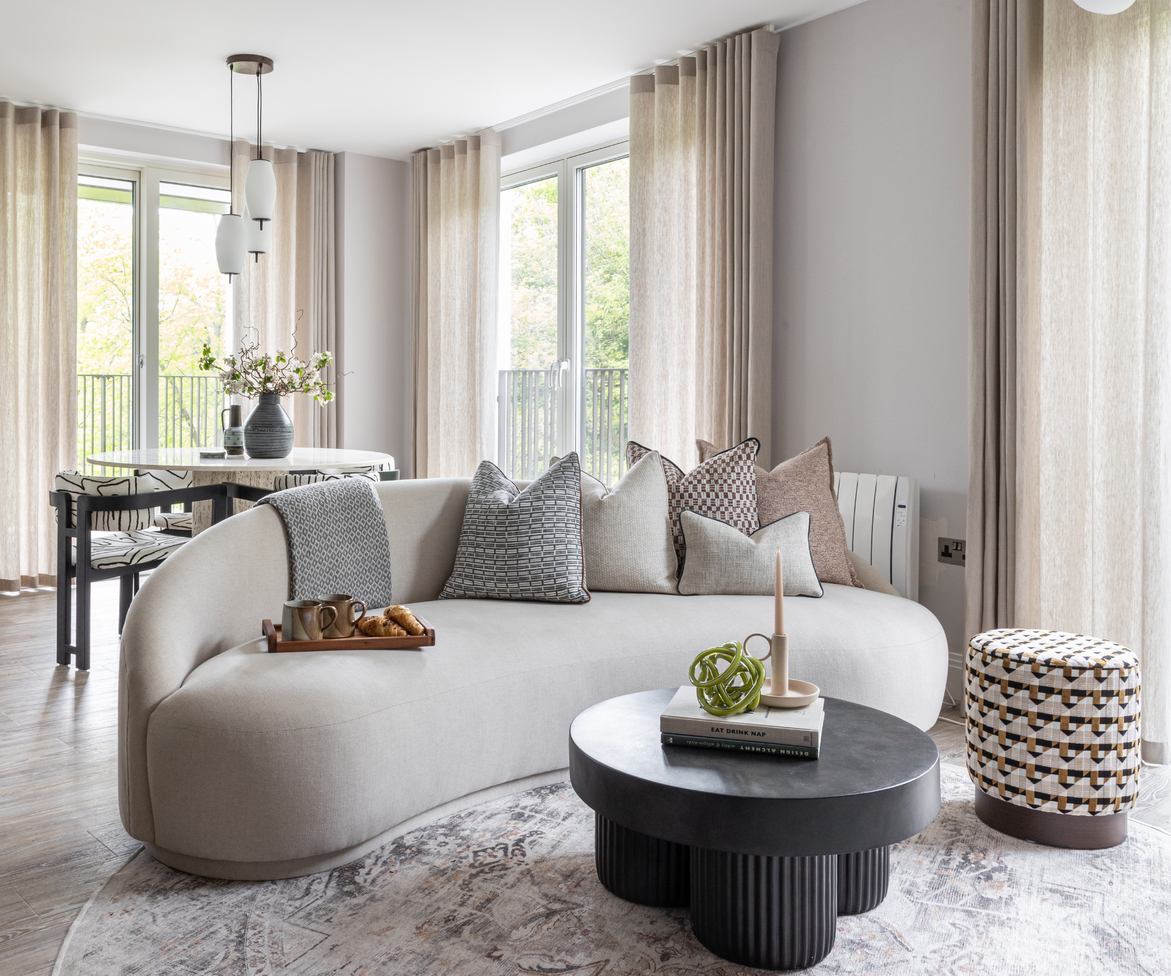 living room with cream curved sofa