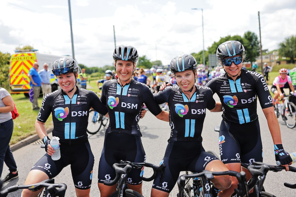 Charlotte Kool (left) with her victorious DSM team after Lorena Wiebes&#039;s stage two win of the 2022 Women&#039;s Tour